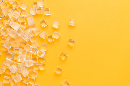 ice cubes, cold on a yellow background