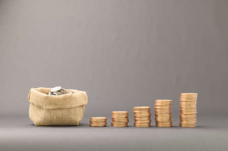 concept of stacked coins Finance to grow income, invest in stocks, trade, save moneyの写真素材