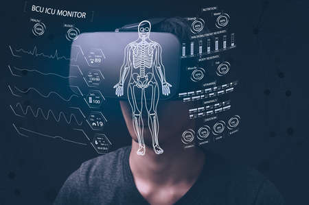 Businessman using glasses via glasses to check business graph VR glasses virtual Globalの写真素材