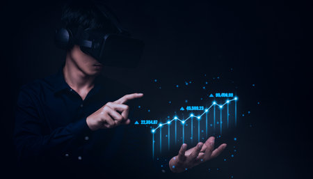 Businessman using Virtual Reality Metaverse glasses to virtual world showing bar graph business growthの写真素材
