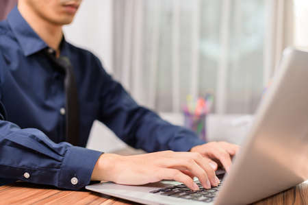 Businessman using notebook computer in officeの写真素材