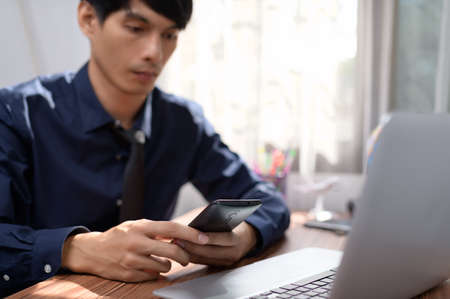 businessman working in front of a notebook computer at a deskの写真素材