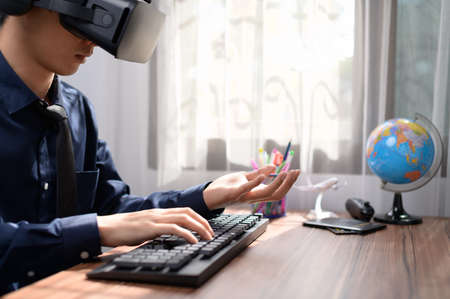 Businessman is using VR glasses to work. Virtual world.の写真素材