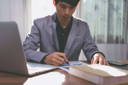 businessman signing documents at workの写真素材