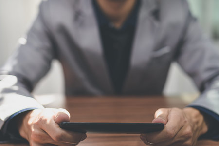 Businessman using smart phone to work, communicate.