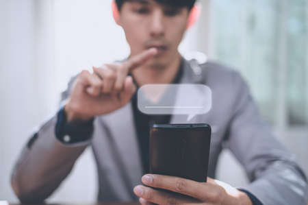 people chatting messages via smartphoneの写真素材