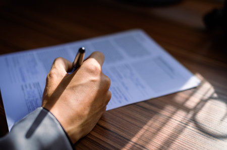businessman reading and writing documents at work