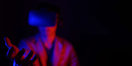 glasses of virtual reality. Augmented reality, game, future technology concept. VR simulated world of metaverse body posture futuristic dressの写真素材