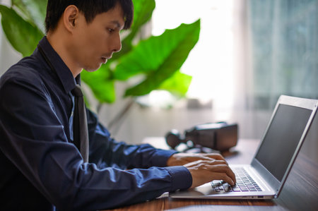 People are using computers, notebooks to communicate, work, play games, watch movies, listen to music.の写真素材