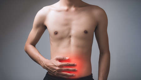 Male patient with abdominal pain, bone, tendon, pain, injury according to medical principles.の写真素材