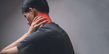 Male patient with pain in the neck, bone, tendon, pain, injury according to medical principles.の写真素材