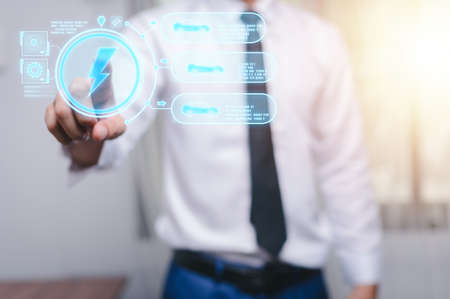 Choosing an electric vehicle. electric car choice. pointing at symbol on charging machine. electric car production Virtual Technology AR Augmented Reality or VR Virtual Reality metaverseの写真素材