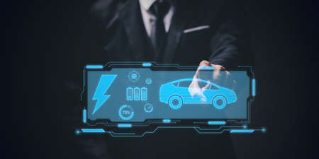 Choosing an electric vehicle. electric car choice. pointing at symbol on charging machine. electric car production Virtual Technology AR Augmented Reality or VR Virtual Reality metaverseの写真素材
