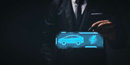 Choosing an electric vehicle. electric car choice. pointing at symbol on charging machine. electric car production Virtual Technology AR Augmented Reality or VR Virtual Reality metaverseの写真素材
