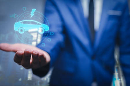 Choosing an electric vehicle. electric car choice. pointing at symbol on charging machine. electric car production Virtual Technology AR Augmented Reality or VR Virtual Reality metaverseの写真素材