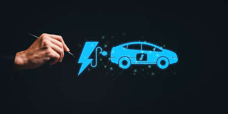 Choosing an electric vehicle. electric car choice. pointing at symbol on charging machine. electric car production Virtual Technology AR Augmented Reality or VR Virtual Reality metaverseの写真素材