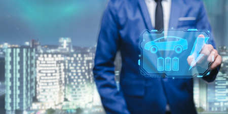 Choosing an electric vehicle. electric car choice. pointing at symbol on charging machine. electric car production Virtual Technology AR Augmented Reality or VR Virtual Reality metaverseの写真素材