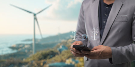 hologram screen Humans controlling the system Wind turbines produce electricity. Eco queue, clean energy from nature.の写真素材
