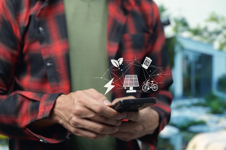 Sustainability at home Sustainable Businesses Green Tech through eco friendly household technologies and practices, recycling waste, using solar panels, saving electricity, using bicycles, picking herbs or vegetables from the garden, tracking electricity usage with mobile appsの写真素材