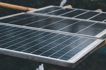Close-up image of solar panels installed on a structure, showcasing their design and arrangement in an outdoor setting. A focus on renewable energy technology.の写真素材