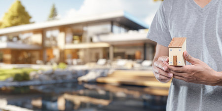 People holding house models, concept of buying, selling, renting houses, paying off houses.の写真素材