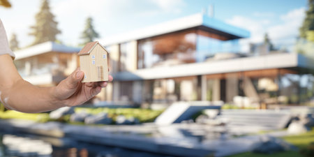People holding house models, concept of buying, selling, renting houses, paying off houses.の写真素材