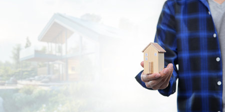 Explore the concept of buying, selling, and renting houses with this image showcasing a model house. Ideal for real estate professionals and buyers.の写真素材