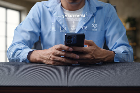 Explore the integration of smart farm technology as a user analyzes data on a mobile device, showcasing innovation and efficiency in modern agriculture.の写真素材