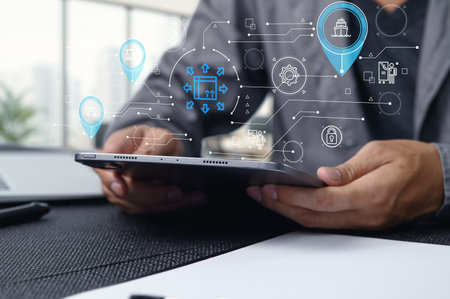 This image illustrates a modern logistics and transportation system in the import export sector. A person uses a tablet to manage data and streamline operations efficiently.の写真素材