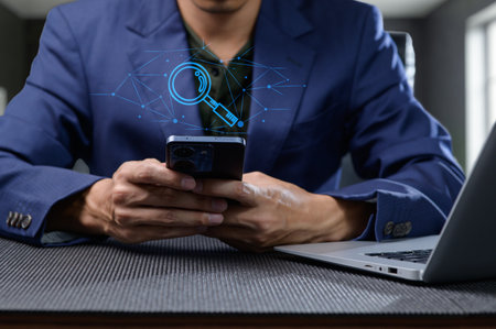 A professional individual using a smartphone while searching for information online, complemented by...