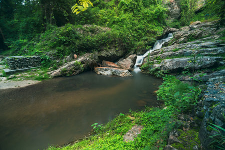 Discover the serene beauty of Huai Kaew Waterfall in Chiang Mai, where cascading water meets lush...