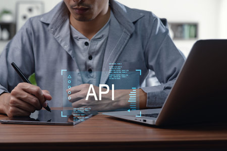 A developer creates and manages API programming interfaces using modern tools. The scene captures...