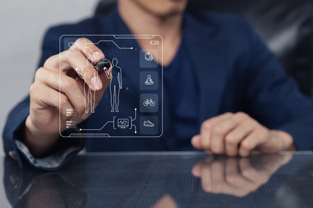 A modern professional interacts with a digital health care interface, showcasing innovative technology for patient management and wellness solutions.の写真素材