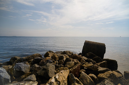 Discover the tranquil beauty of Nam Daeng Beach in Rayong Province, featuring calm waters and rocky...