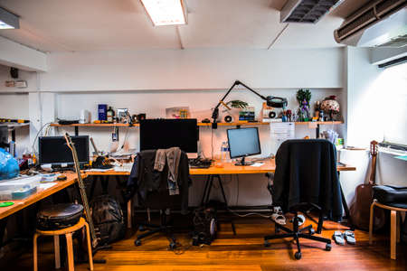 Office workplace with computer and mess of disorder object.