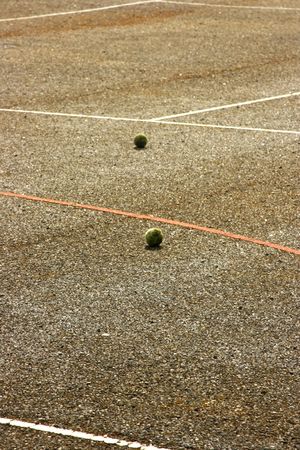 Tennis balls on courtの写真素材