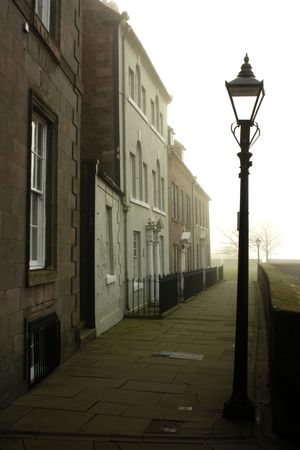 A misty day in a narrow lane or street in Berwick upon Tweed, Englandの写真素材