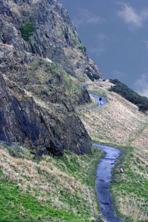 A path round Salisbury Crags in Holyrood Park, Edinburgh, Scotlandの写真素材