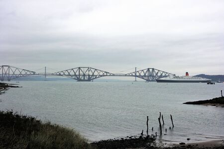 Luxury Cruise Liner Farewell Tour of UK. Anchored in Firth of Forth at South Queensferry, Scotland October 2008 near Forth Rail and Road Bridges. の写真素材