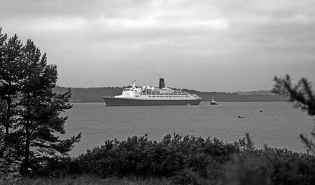 Cruise Liner Farewell Tour of UK. Anchored in Firth of Forth at South Queensferry, Scotland October 2008 near Forth Rail and Road Bridges. の写真素材