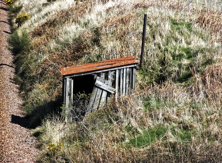 Old weathered wooden shack on bankingの写真素材