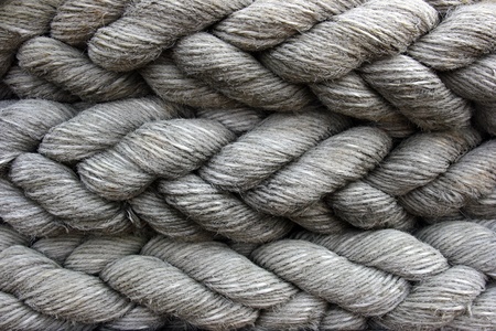 A close-up of a ship's mooring cable or hawser stowed away.の写真素材