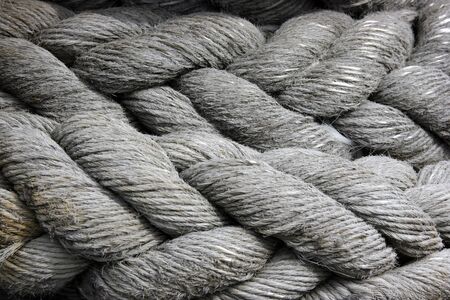 A close-up of a ship's mooring cable or hawser neatly stowed away.の写真素材