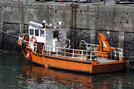Fishing boat moored in Port Patrick Harbour, Galloway, Scotlandの写真素材