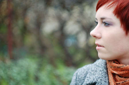 Portait of beautiful woman outdoor looking to the left from the right-hand side of the picture.の写真素材