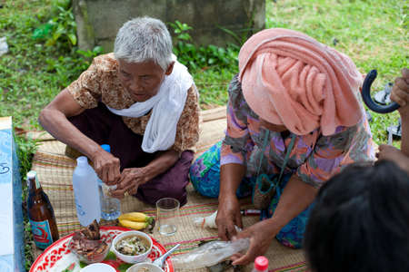 SURIN, THAILAND - September 18   Unidentified people will make merit, charity with monks for deceased on September 18, 2013 in Surin, Thailandのeditorial素材