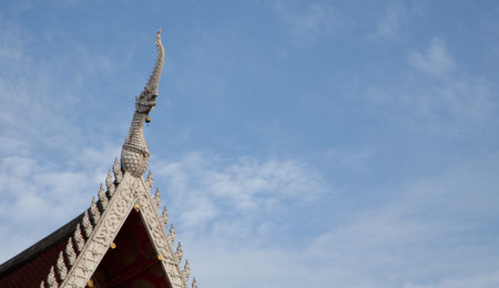 Statue of serpent  Thai style stucco on the roof in Bangkok, Thailand