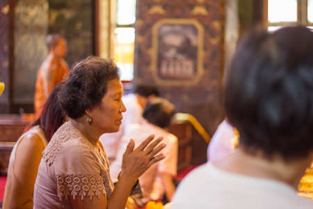 BANGKOK, THAILAND - October 3   Thai Buddhist woman respect to Buddha image on October 3, 2013 のeditorial素材
