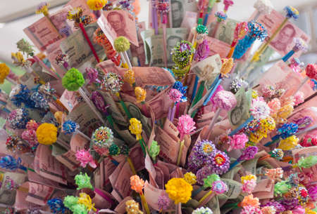 Donate Thai currently,  Money to charity  in buddhist wayの写真素材