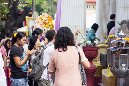 BANGKOK, THAILAND - October 3   Thai Buddhist people respect to Buddha image with flower on October...